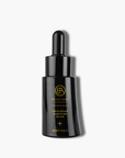 Black glass bottle skincare with gold text