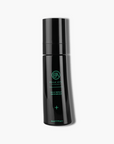 Black skincare bottle with green text on a white background
