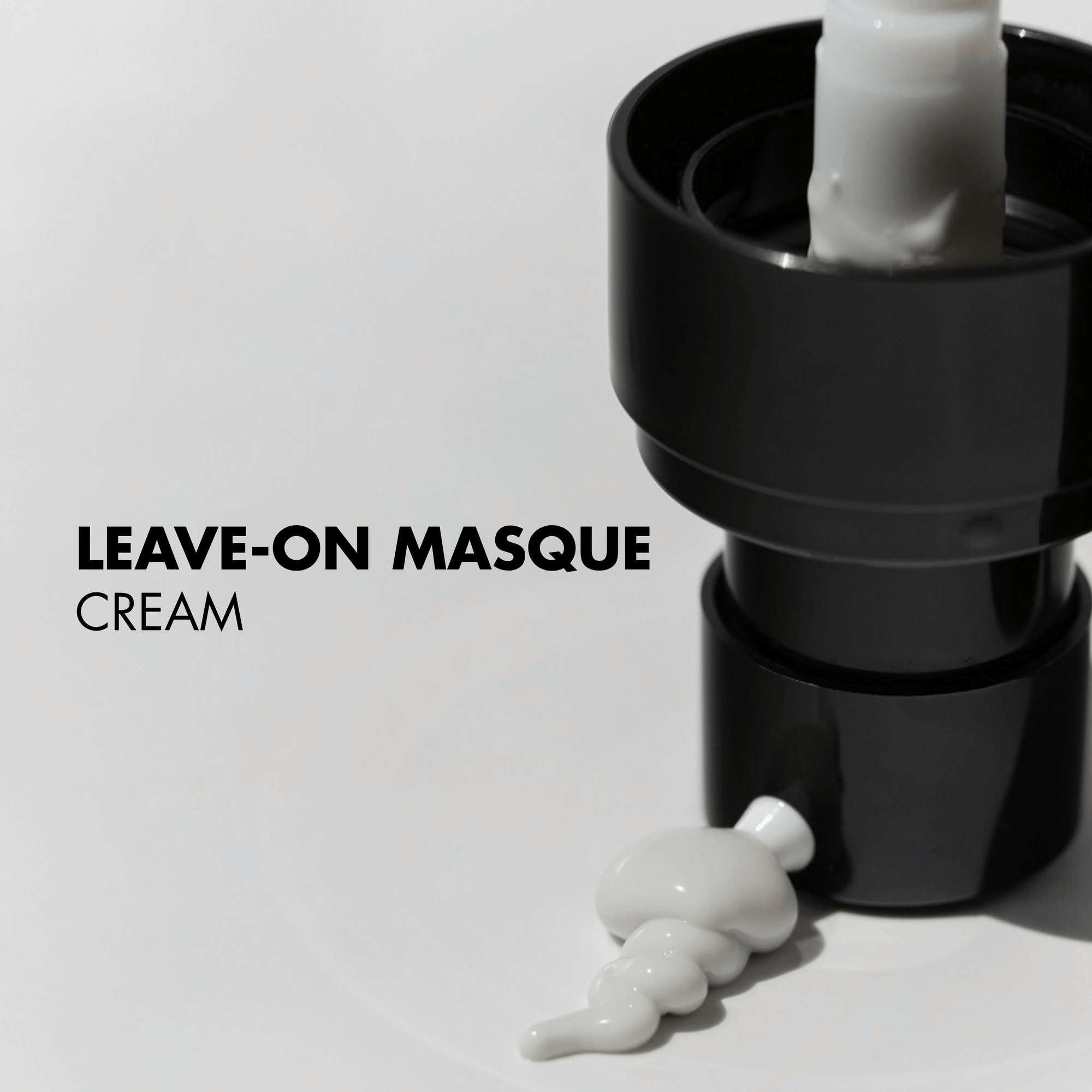 Black skincare pump with white leave-on masque cream on a light gray background