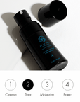 black bottle on white background with text representing where the product fits in skincare outine