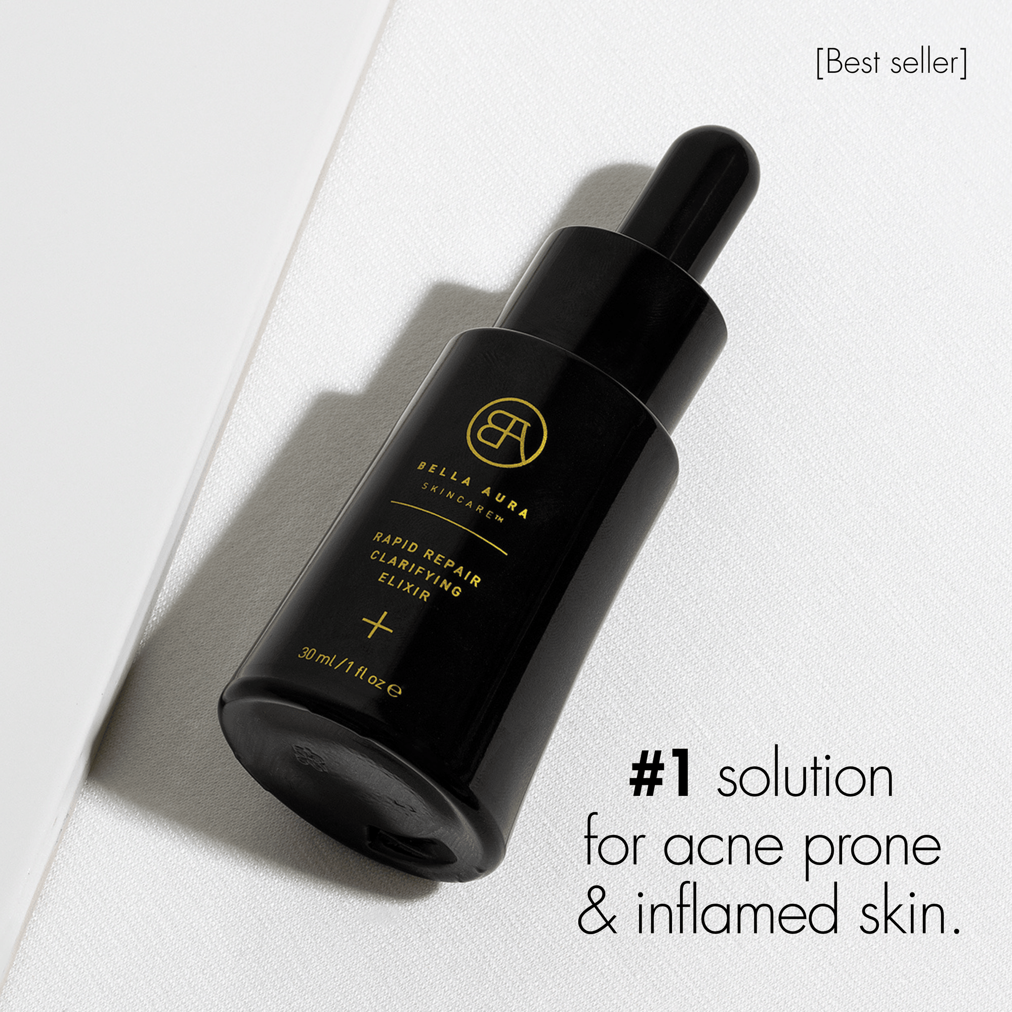 Black bella aura skincare dropper bottle with gold text on a white background