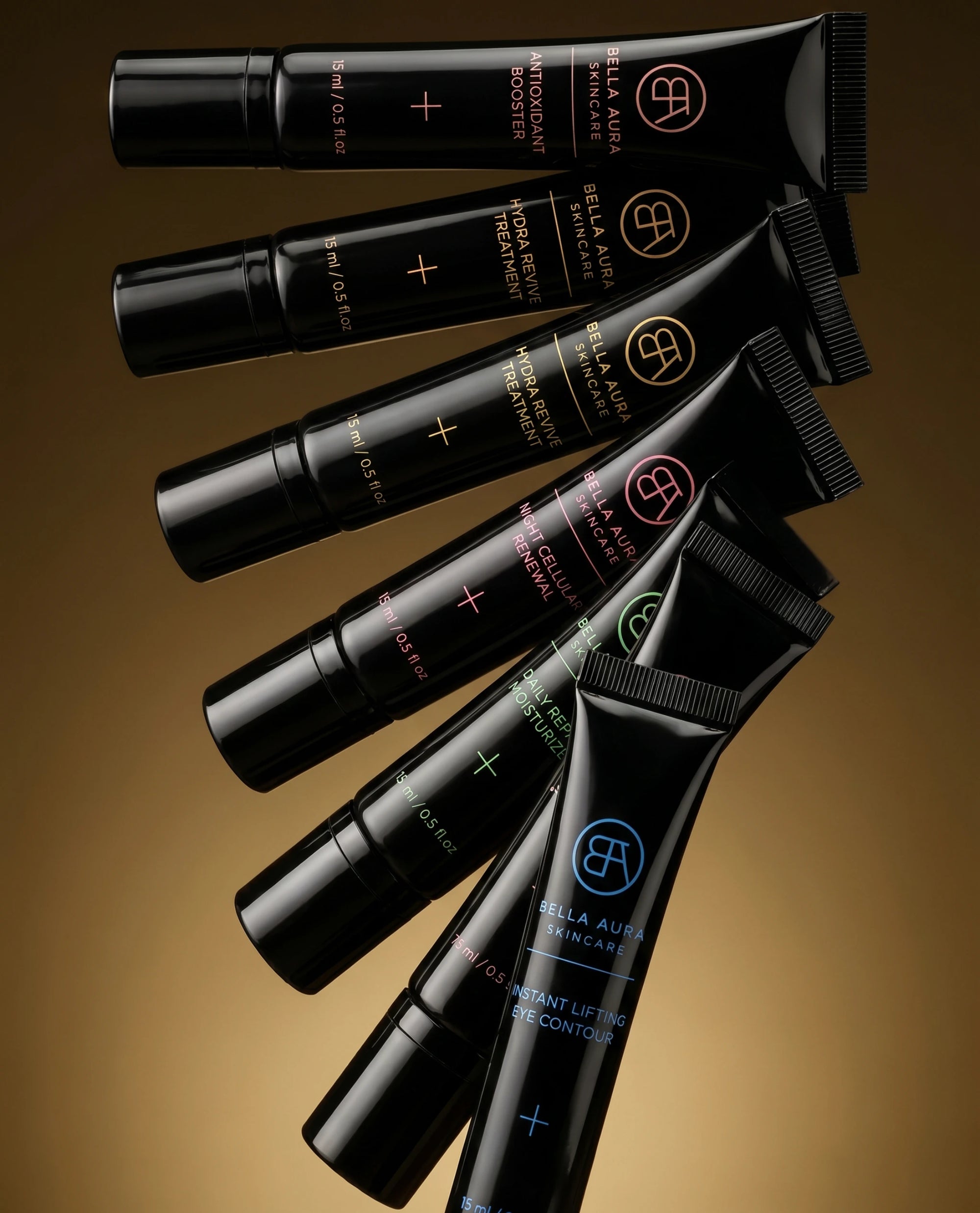 Set of bella aura skincare black cosmetic tubes with visible branding on a brown background
