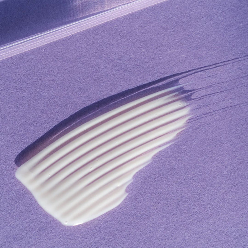 white cream in a purple background
